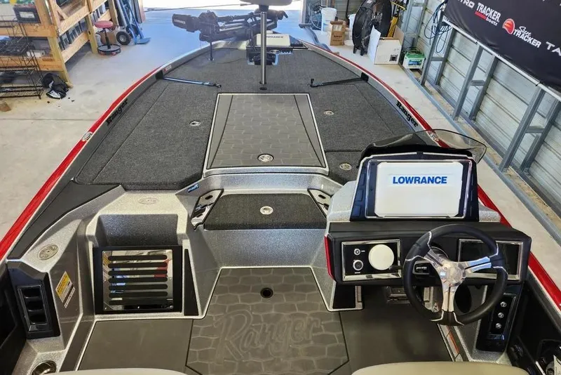 Slide: The Image of 2026 Ranger Z520R Cup-Equipped boat interior with Lowrance navigation system in a garage setting. - 5
