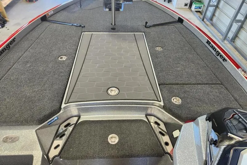 Slide: The Image of 2026 Ranger Z520R Cup-Equipped boat deck with textured flooring and storage compartments. - 7