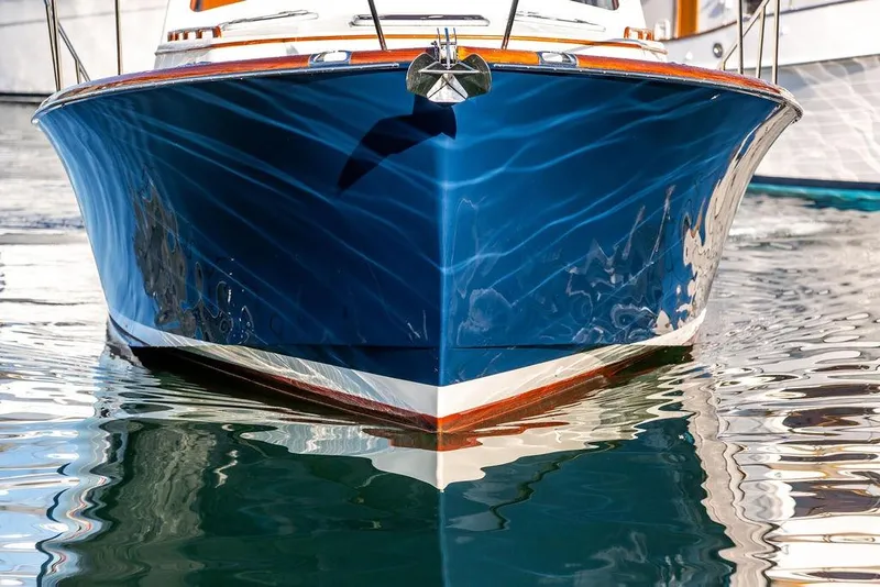 Slide: The Image of 2005 Hinckley Talaria 44 yacht with elegant wooden accents and sleek design. - 5