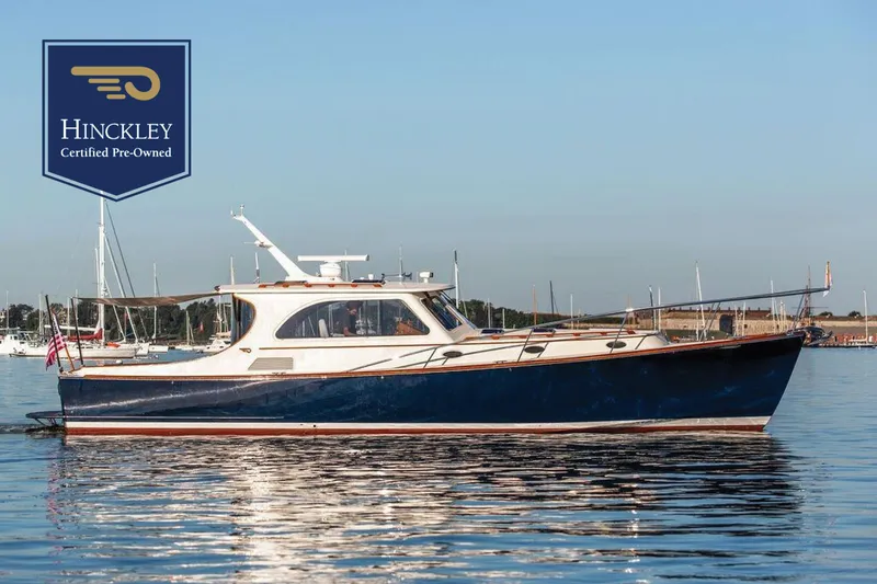 The Image of 2005 Hinckley Talaria 44 yacht on calm water, certified pre-owned. - 0