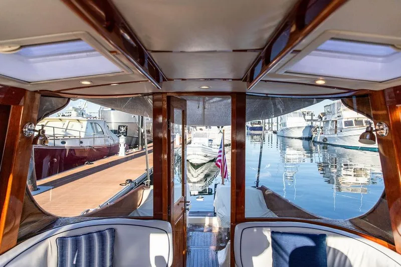 Slide: The Image of Luxurious interior of 2005 Hinckley Talaria 44 yacht with elegant wood finishes and plush seating. - 11