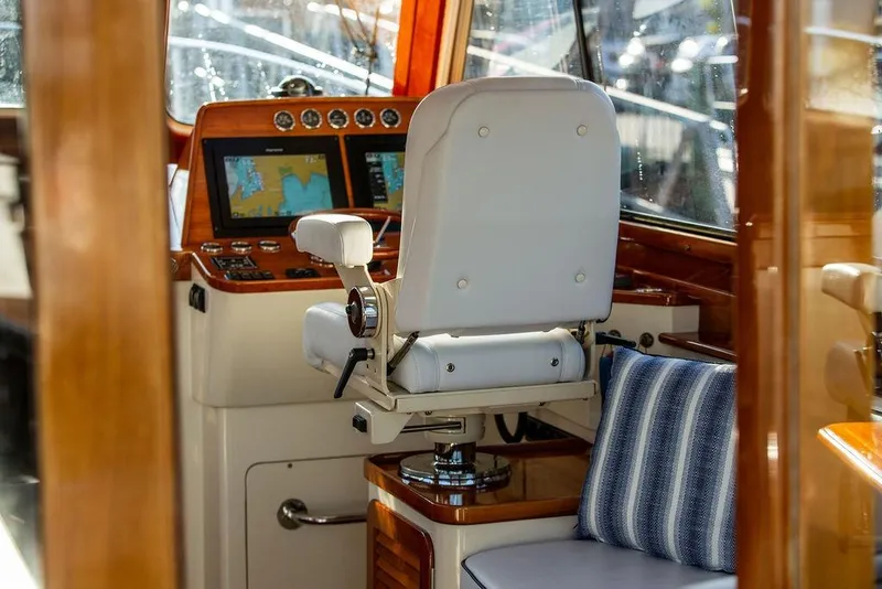 Slide: The Image of Luxurious interior of 2005 Hinckley Talaria 44 yacht with polished wood and plush seating. - 15