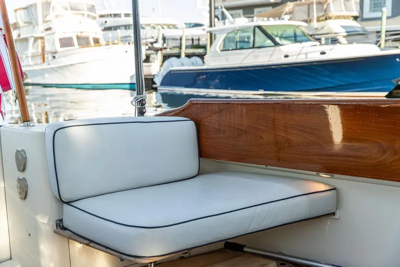 Slide: The Image of 2005 Hinckley Talaria 44 yacht docked near waterfront buildings. - 19