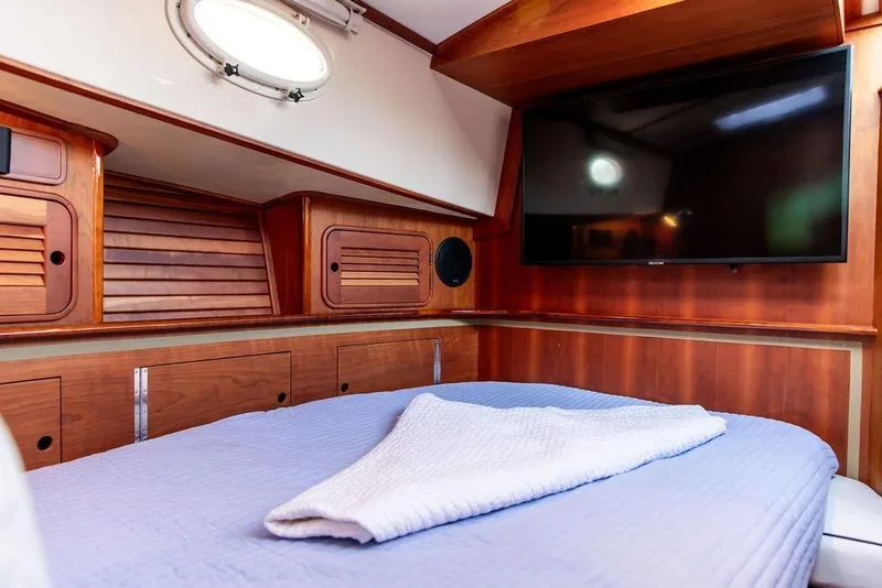 Slide: The Image of Luxurious wood interior of 2005 Hinckley Talaria 44 yacht with polished flooring. - 28