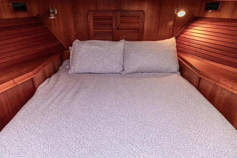 Slide: The Image of Luxurious 2005 Hinckley Talaria 44 yacht bathroom with wood accents and modern fixtures. - 30