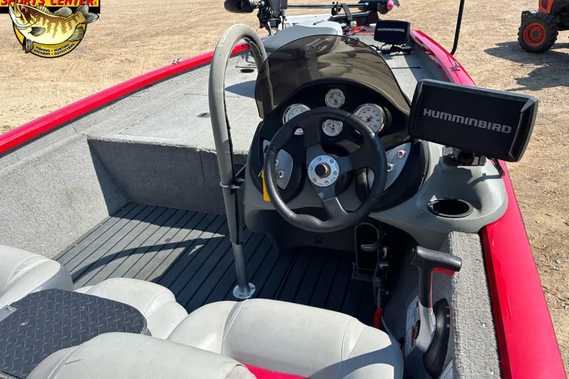 Slide: The Image of 2013 Tracker Pro Team 175 TXW boat interior with steering wheel and Humminbird fish finder. - 4