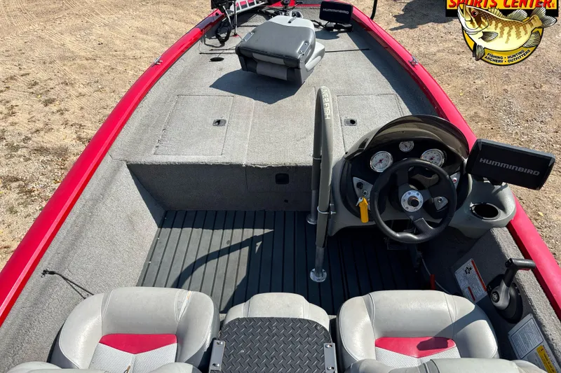 Slide: The Image of 2013 Tracker Pro Team 175 TXW boat interior with steering wheel and seats. - 5
