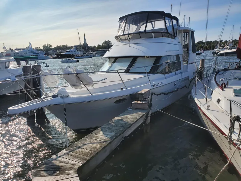 Slide: The Image of 2000 Carver 356 Aft Cabin Motor Yacht docked at marina, sunny day. - 2