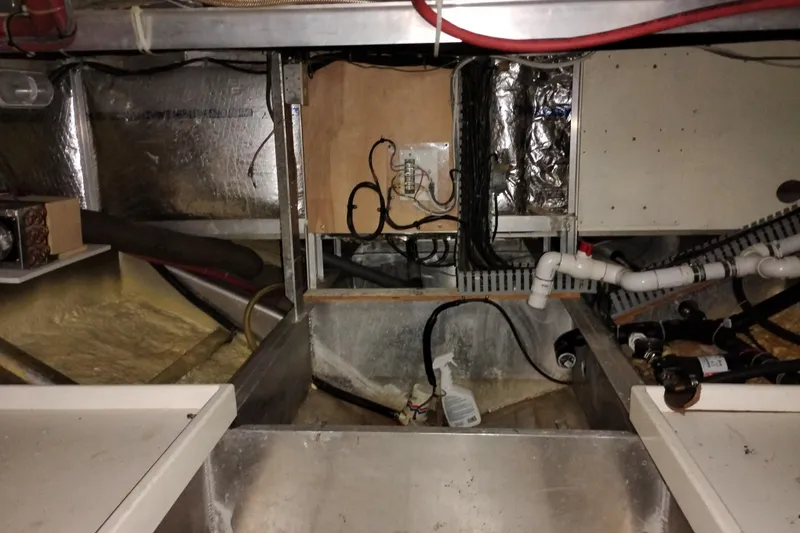 Slide: The Image of Engine room of a 1989 Custom Aluminum Pilothouse J Simpson, showing wiring and plumbing. - 108