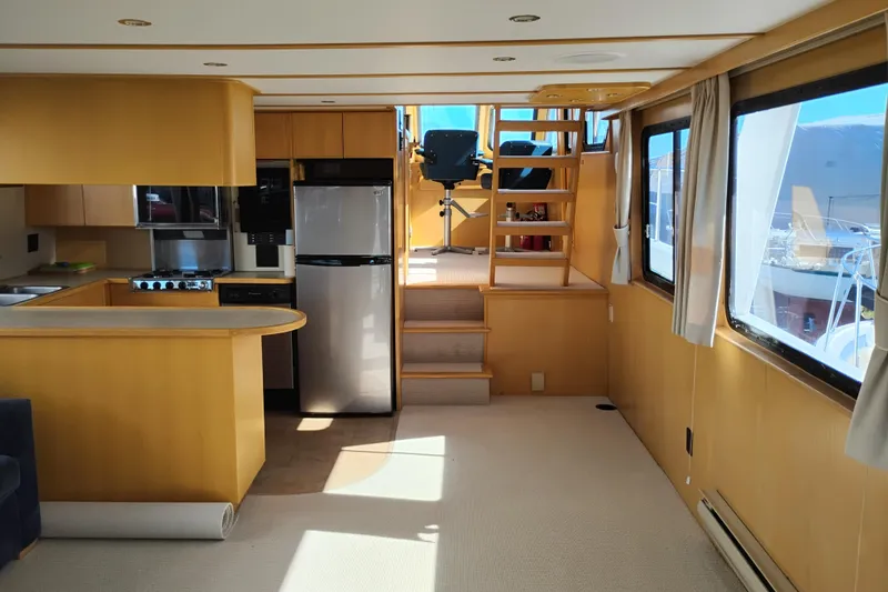 Slide: The Image of Interior of 1989 Custom Aluminum Pilothouse J Simpson with kitchen and stairs to helm. - 14