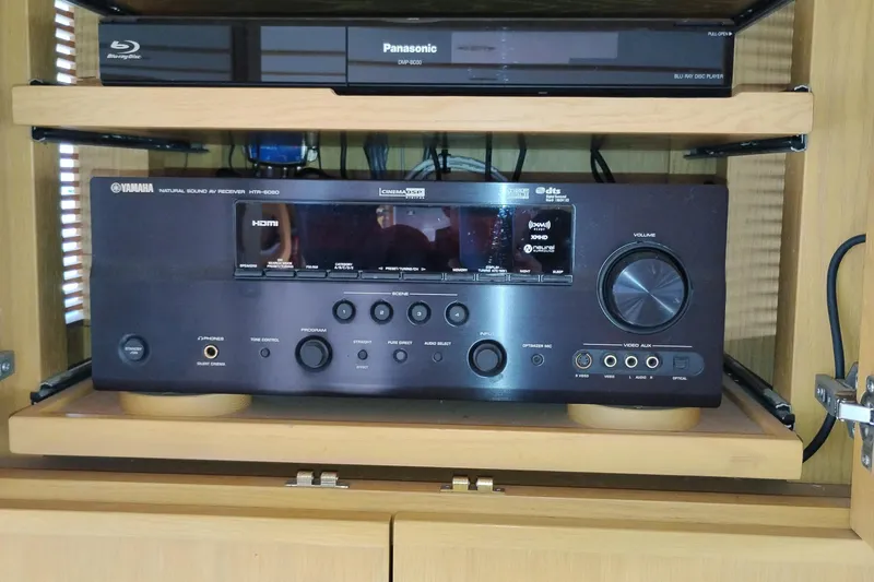Slide: The Image of Yamaha AV receiver and Panasonic Blu-ray player in a wooden cabinet, 1989 Aluminum Pilothouse J Simpson. - 19