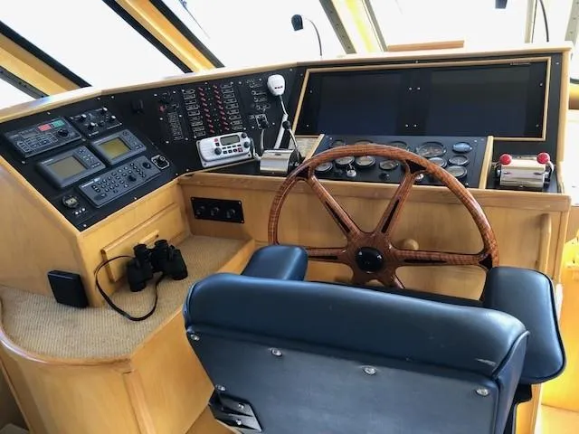 Slide: The Image of Pilothouse interior of 1989 Custom Aluminum Pilothouse J Simpson with wooden steering wheel. - 28