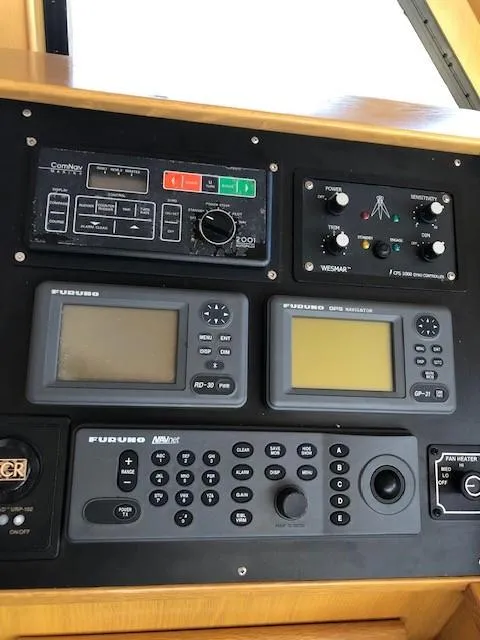 Slide: The Image of Control panel of 1989 Custom Aluminum Pilothouse J Simpson with navigation and communication equipment. - 31