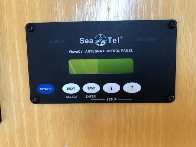 Slide: The Image of Sea Tel WaveCall antenna control panel on wooden surface, featuring buttons for power, next, save, and setup. - 40