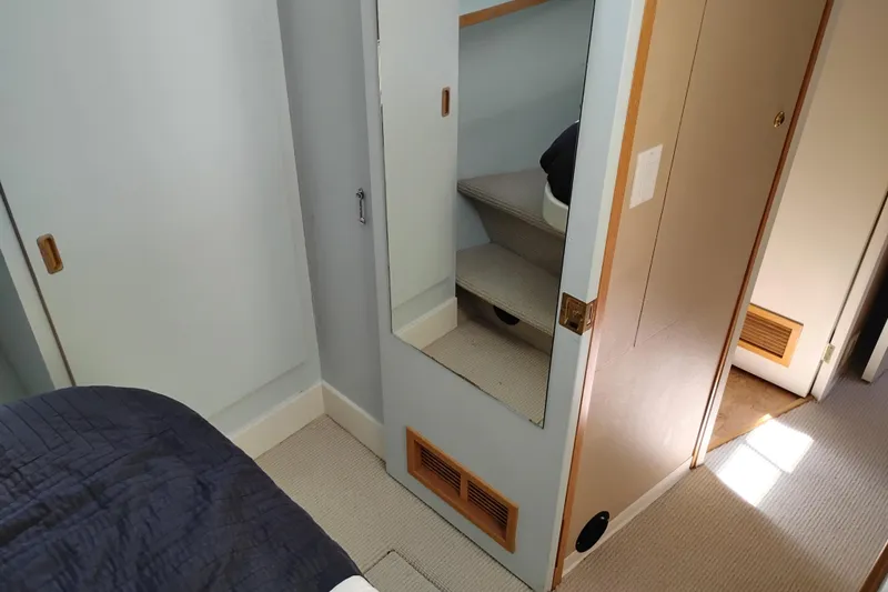 Slide: The Image of Interior of 1989 Custom Aluminum Pilothouse J Simpson with stairs and mirror. - 59