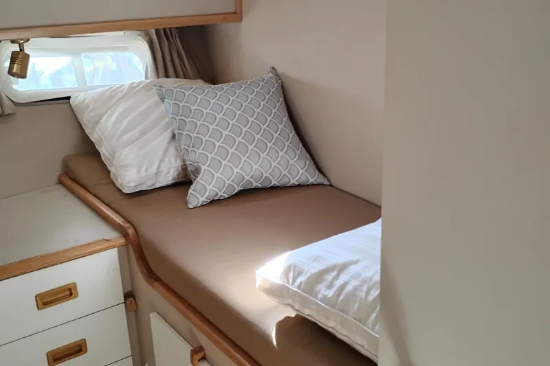 Slide: The Image of Cozy cabin interior of 1989 Custom Aluminum Pilothouse J Simpson with bed and pillows. - 66