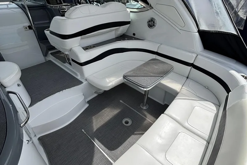 Slide: The Image of 2015 Formula 37 Performance Cruiser interior with white seating and a small table. - 10