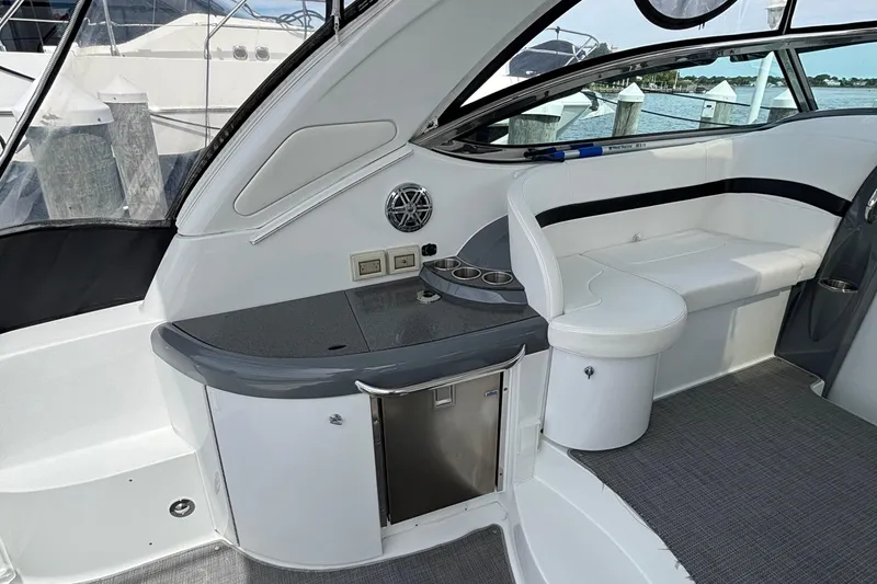Slide: The Image of 2015 Formula 37 Performance Cruiser interior with seating and kitchenette. - 11