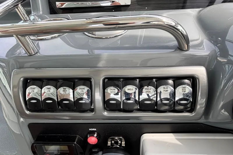 Slide: The Image of Control panel of a 2015 Formula 37 Performance Cruiser with labeled switches. - 20