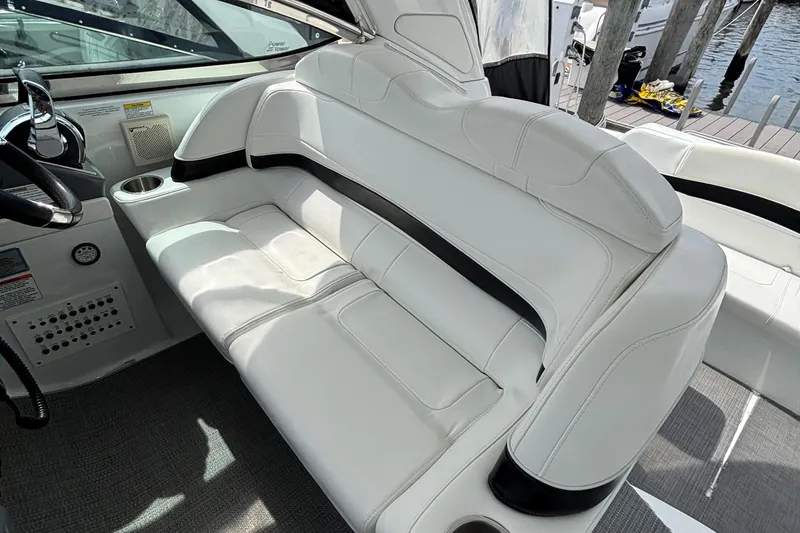 Slide: The Image of 2015 Formula 37 Performance Cruiser interior with white leather seating and control panel. - 24