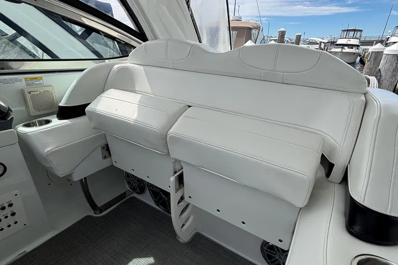 Slide: The Image of 2015 Formula 37 Performance Cruiser interior with white leather seating and cup holder. - 25