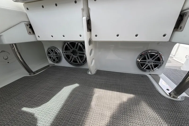 Slide: The Image of 2015 Formula 37 Performance Cruiser interior with JL Audio speakers and carpeted flooring. - 26