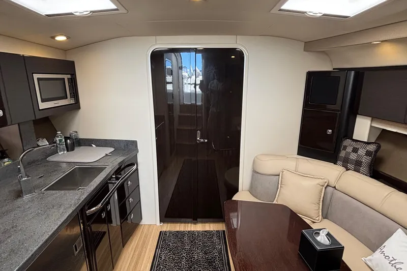 Slide: The Image of Interior of 2015 Formula 37 Performance Cruiser with modern kitchen and cozy seating area. - 33