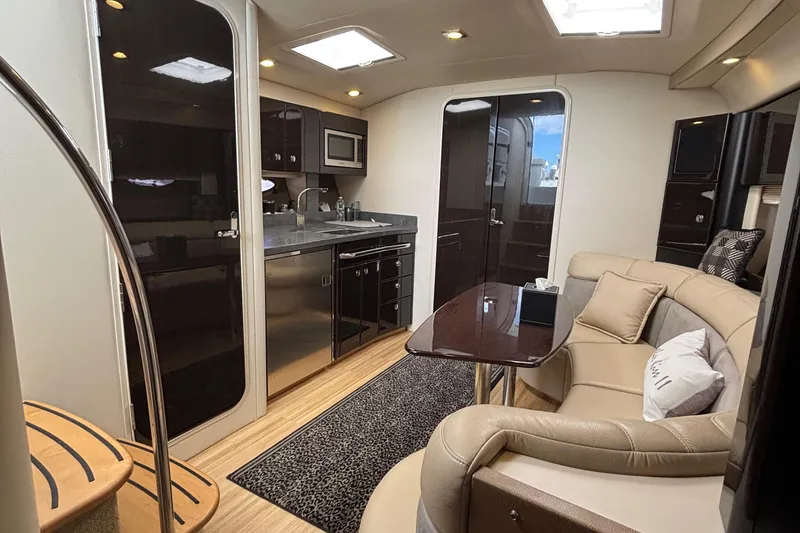 Slide: The Image of Luxurious interior of a 2015 Formula 37 Performance Cruiser with modern kitchen and seating area. - 39