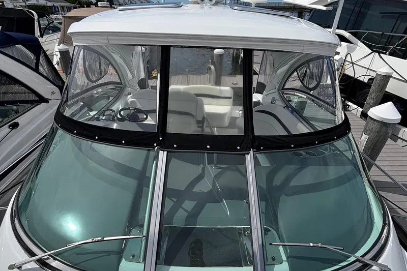 Slide: The Image of 2015 Formula 37 Performance Cruiser with sleek windshield and spacious cockpit at marina. - 45