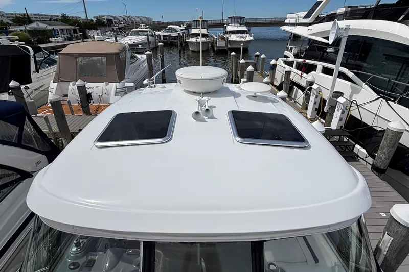 Slide: The Image of 2015 Formula 37 Performance Cruiser docked at marina, top view of deck and hatches. - 46