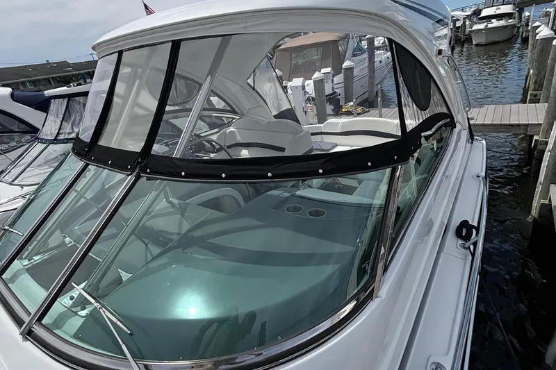 Slide: The Image of 2015 Formula 37 Performance Cruiser docked at marina, featuring sleek design and spacious cockpit. - 49