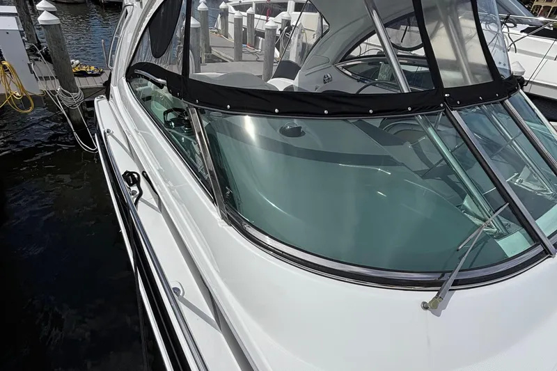 Slide: The Image of 2015 Formula 37 Performance Cruiser docked at marina, showcasing sleek design and windshield. - 50