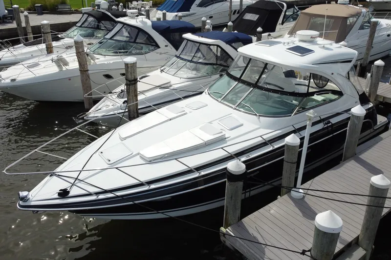 Slide: The Image of 2015 Formula 37 Performance Cruiser docked at marina with other boats. - 6