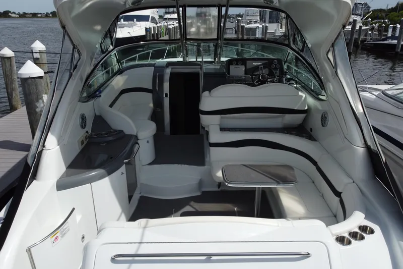 Slide: The Image of 2015 Formula 37 Performance Cruiser interior with sleek seating and modern helm at dock. - 7