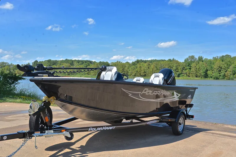 Slide: The Image of 2024 Polar Kraft 165 boat on trailer by a scenic lake. - 10