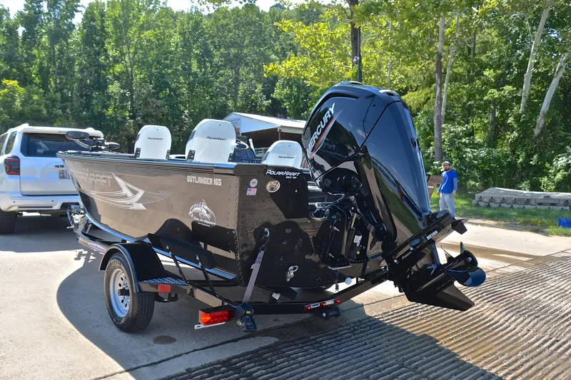 Slide: The Image of 2024 Polar Kraft 165 boat with Mercury engine on trailer, ready for launch. - 12
