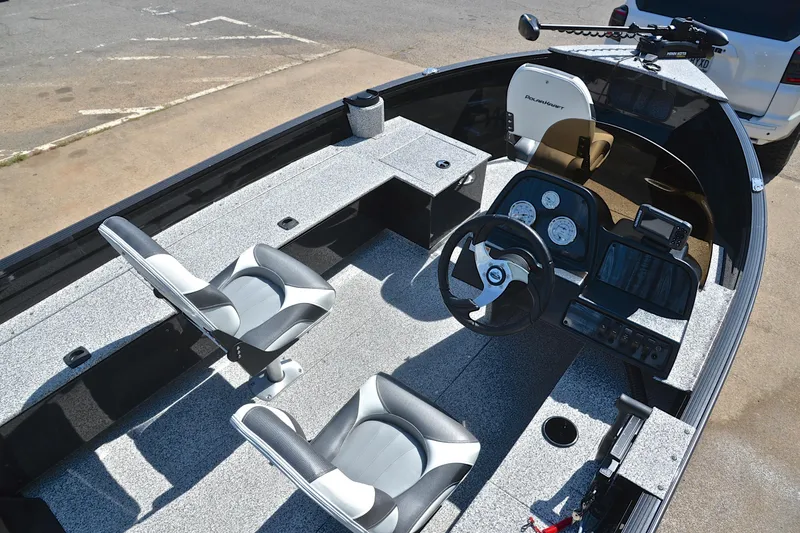 Slide: The Image of 2024 Polar Kraft 165 boat interior with steering console and seating. - 19