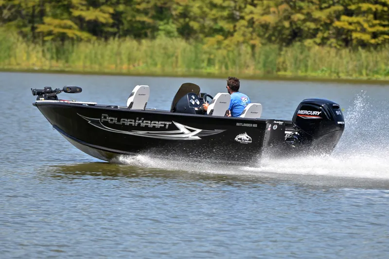 Slide: The Image of 2024 Polar Kraft 165 boat speeding on a lake with Mercury engine. - 4
