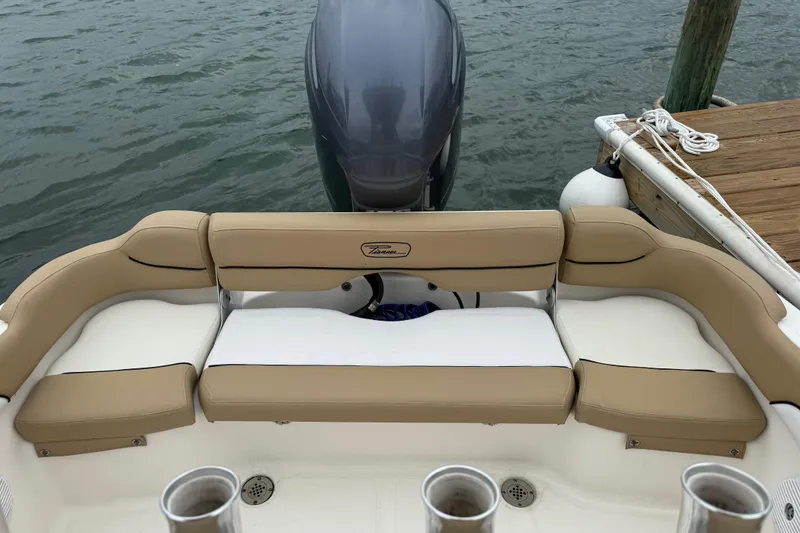 Slide: The Image of 2016 Pioneer 197 Islander boat interior with tan seating and steering wheel. - 12