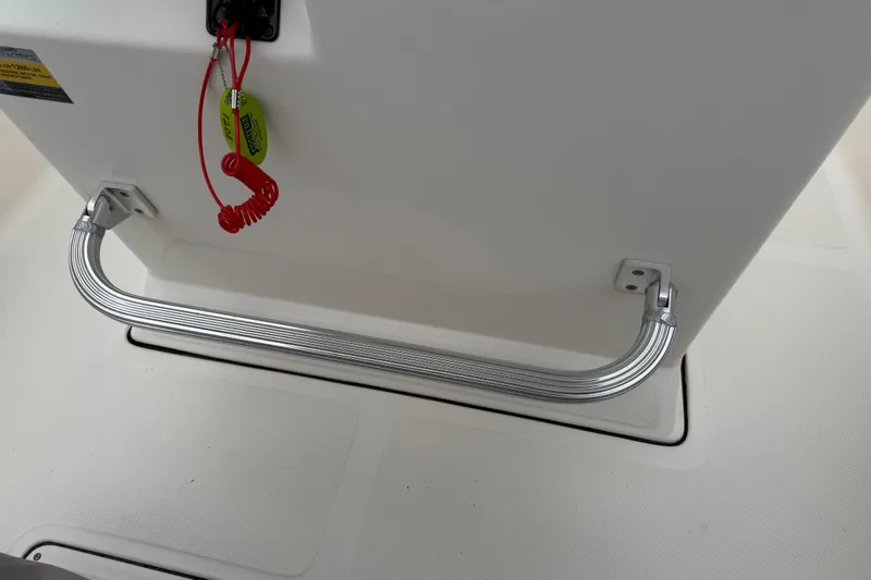 Slide: The Image of 2016 Pioneer 197 Islander boat with tan seating and outboard motor at dock. - 14