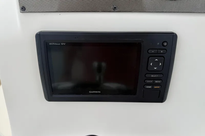 Slide: The Image of 2016 Pioneer 197 Islander boat interior with safety handle and ignition key. - 16