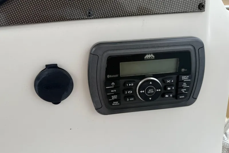 Slide: The Image of 2016 Pioneer 197 Islander boat dashboard with Garmin navigation and Yamaha controls. - 17