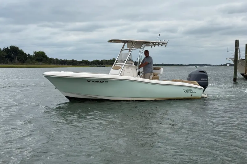 Slide: The Image of 2016 Pioneer 197 Islander boat on water with Yamaha engine, scenic background. - 3