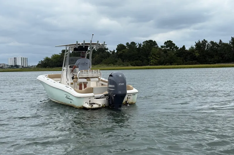 Slide: The Image of 2016 Pioneer 197 Islander boat on calm water with overcast sky. - 6