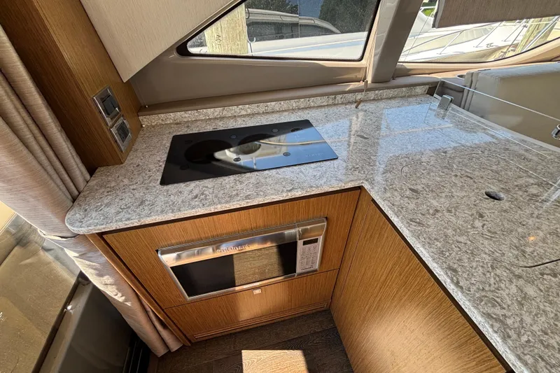Slide: The Image of Luxurious kitchen area in 2018 Sea Ray Sundancer 460 yacht with modern appliances. - 14