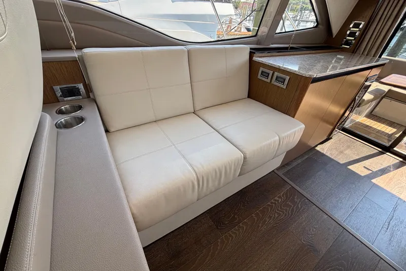 Slide: The Image of Luxurious interior of 2018 Sea Ray Sundancer 460 yacht with cream leather seating. - 15