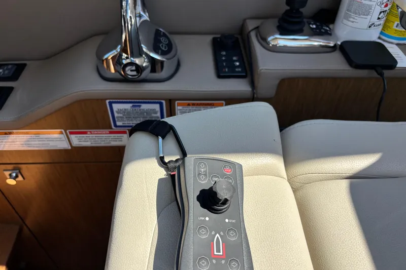 Slide: The Image of Control panel of a 2018 Sea Ray Sundancer 460 yacht, featuring joystick and throttle. - 21