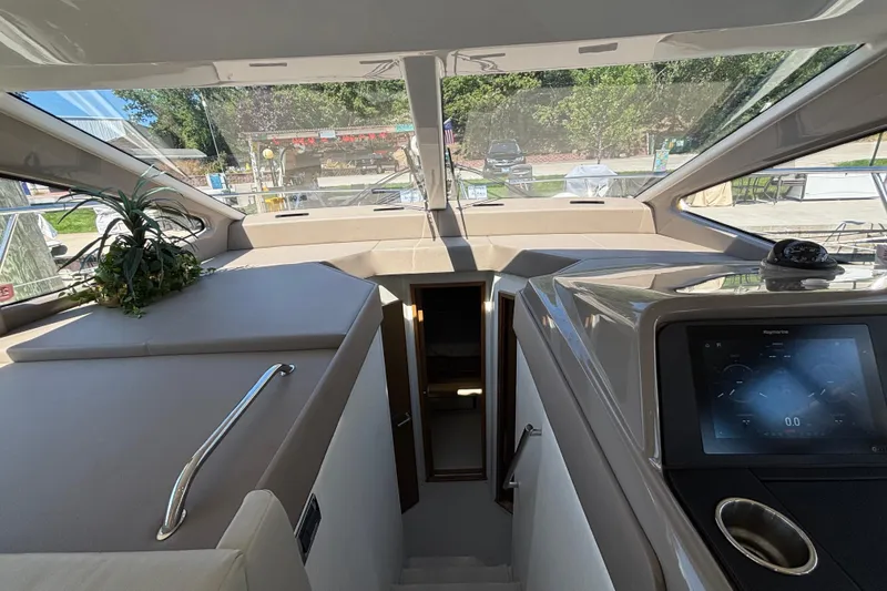 Slide: The Image of Interior view of 2018 Sea Ray Sundancer 460 yacht, featuring modern dashboard and sleek design. - 26