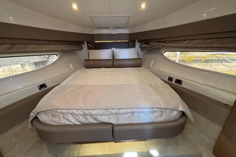 Slide: The Image of Luxurious cabin interior of 2018 Sea Ray Sundancer 460 yacht with cozy bed and ambient lighting. - 27