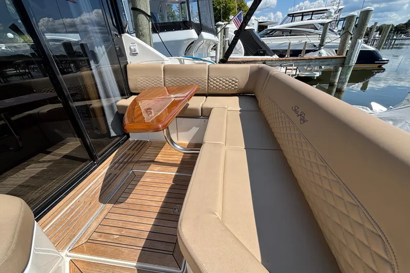 Slide: The Image of Luxurious seating area on a 2018 Sea Ray Sundancer 460 yacht with wooden table. - 4